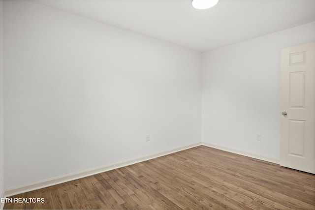 508 E Oldham Ave, Knoxville, TN 37917 - unfurnished room with wood finished floors and baseboards