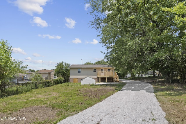 508 E Oldham Ave, Knoxville, TN 37917 - view of front of home featuring a wooden deck, gravel driveway, and stairway