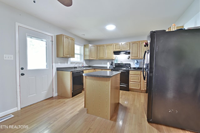 615 Mary St, Russellville, TN 37860 - kitchen with black appliances, a center island, a sink, light wood-style flooring, and light brown cabinetry