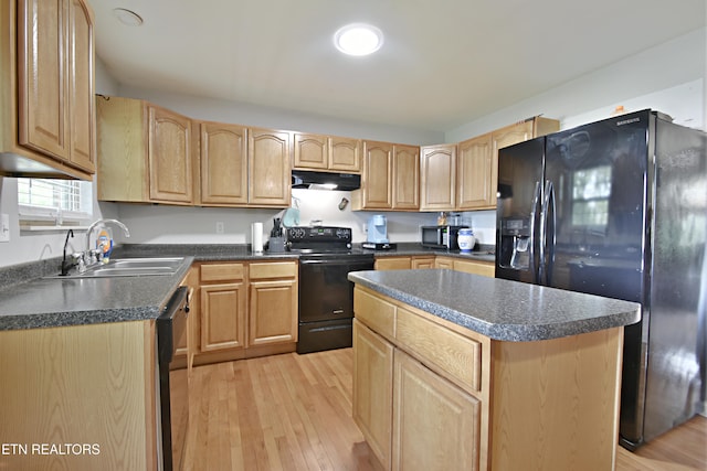615 Mary St, Russellville, TN 37860 - kitchen with black appliances, under cabinet range hood, light brown cabinetry, dark countertops, and light wood finished floors