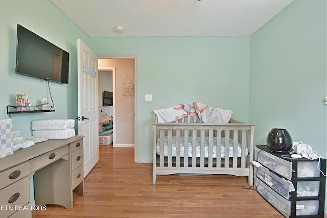 615 Mary St, Russellville, TN 37860 - bedroom featuring light wood-type flooring, a nursery area, and baseboards