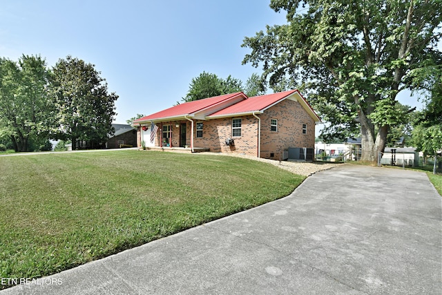 615 Mary St, Russellville, TN 37860 - ranch-style home with a porch, brick siding, metal roof, central air condition unit, and driveway