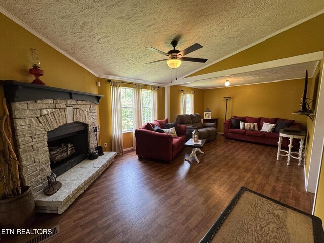 108 Hawn Dr, Crab Orchard, TN 37723 - living room featuring lofted ceiling, a textured ceiling, ceiling fan, a fireplace, and wood finished floors