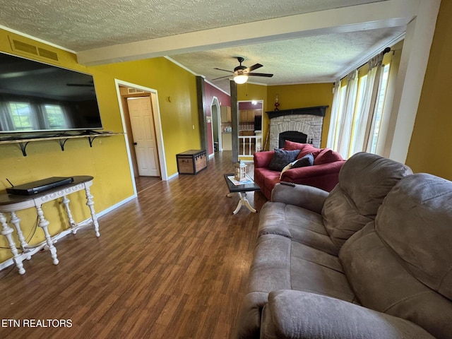108 Hawn Dr, Crab Orchard, TN 37723 - living room with a textured ceiling, wood finished floors, healthy amount of natural light, ceiling fan, and baseboards