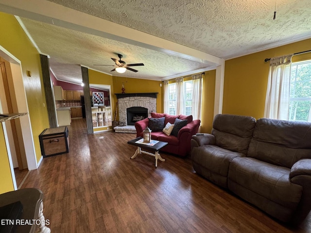 108 Hawn Dr, Crab Orchard, TN 37723 - living area with a textured ceiling, plenty of natural light, ceiling fan, wood finished floors, and a fireplace