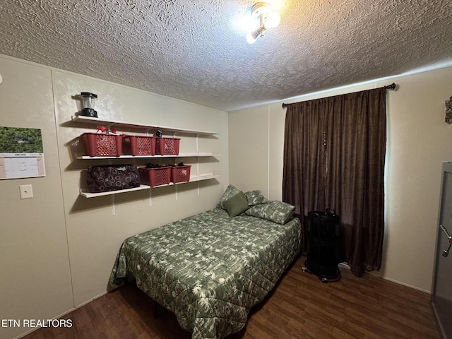 108 Hawn Dr, Crab Orchard, TN 37723 - bedroom featuring a textured ceiling and wood finished floors