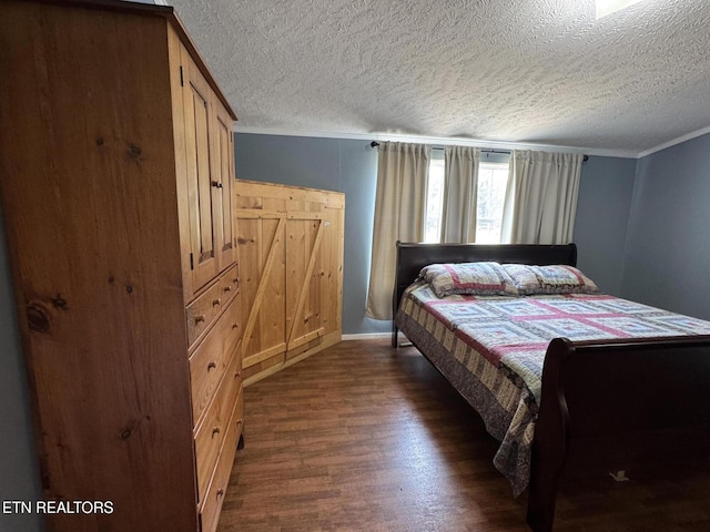 108 Hawn Dr, Crab Orchard, TN 37723 - bedroom with dark wood-style floors, a textured ceiling, ornamental molding, and baseboards