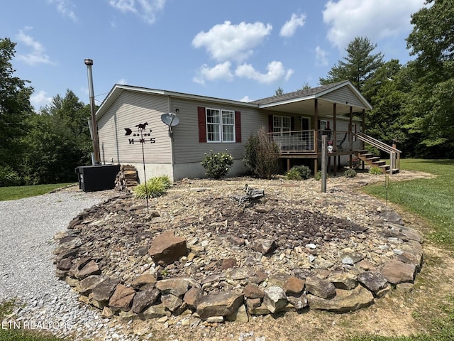 108 Hawn Dr, Crab Orchard, TN 37723 - manufactured / mobile home with a porch and stairway