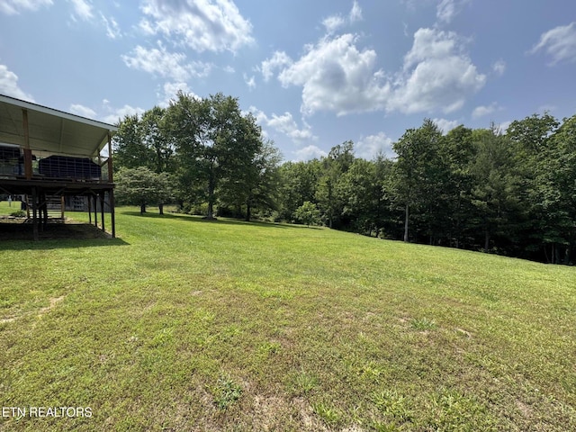 108 Hawn Dr, Crab Orchard, TN 37723 - view of grassy yard with a wooden deck