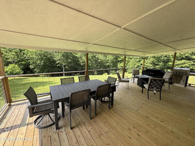 108 Hawn Dr, Crab Orchard, TN 37723 - wooden terrace with outdoor dining space, a yard, outdoor lounge area, view of wooded area, and a grill