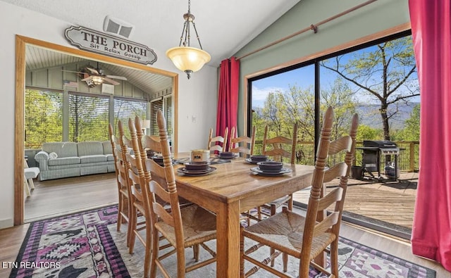 725 Sunshine Trl, Gatlinburg, TN 37738 - dining space featuring vaulted ceiling, ceiling fan, and wood finished floors