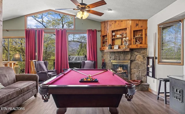 725 Sunshine Trl, Gatlinburg, TN 37738 - game room with a ceiling fan, a stone fireplace, vaulted ceiling, wood finished floors, and billiards