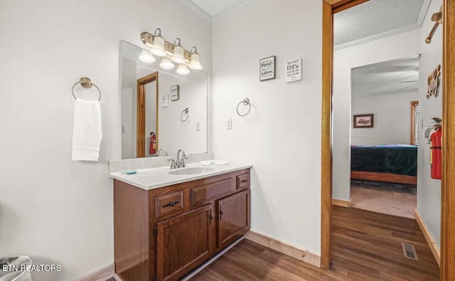 725 Sunshine Trl, Gatlinburg, TN 37738 - ensuite bathroom with wood finished floors, vanity, ornamental molding, and baseboards