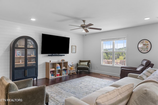 137 Storm Ln, Jacksboro, TN 37757 - living room with dark wood-type flooring, a ceiling fan, recessed lighting, baseboards, and wooden walls