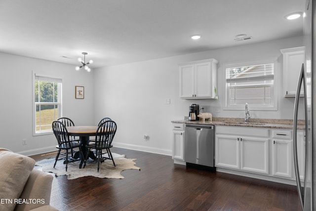 137 Storm Ln, Jacksboro, TN 37757 - kitchen with appliances with stainless steel finishes, a sink, dark wood-style floors, white cabinets, and recessed lighting