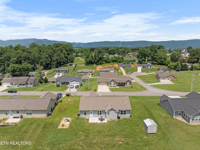 137 Storm Ln, Jacksboro, TN 37757 - aerial perspective of suburban area featuring a mountainous background