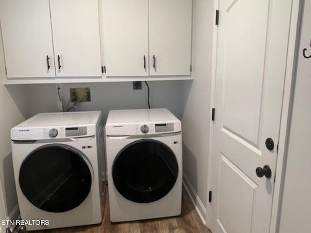 834 Hinkle Estates Dr, Seymour, TN 37865 - washroom featuring washer and dryer, cabinet space, wood finished floors, and baseboards