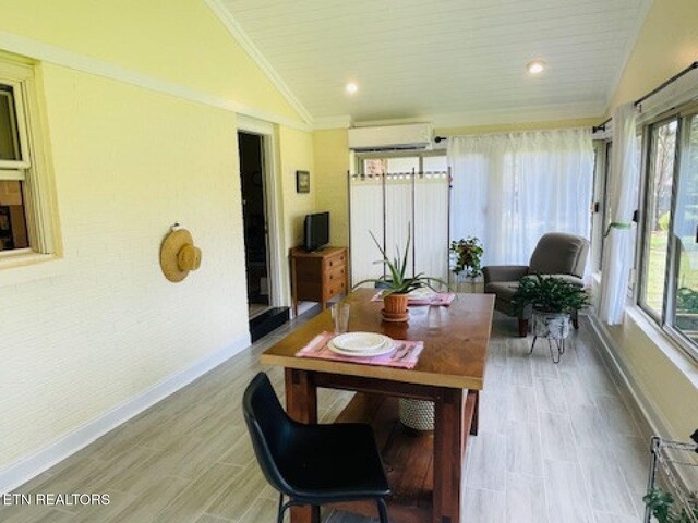 834 Hinkle Estates Dr, Seymour, TN 37865 - sunroom with a wall mounted air conditioner, lofted ceiling, plenty of natural light, baseboards, and recessed lighting