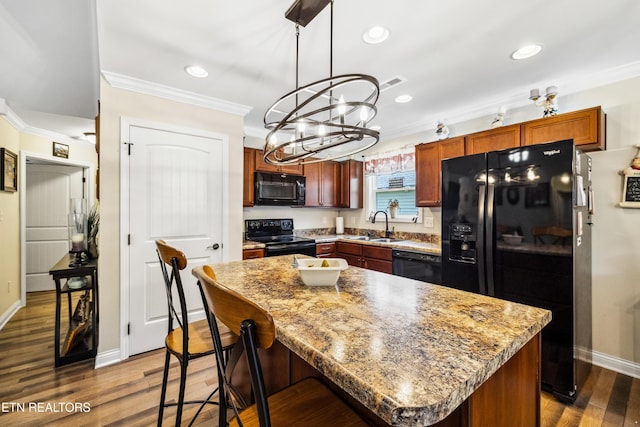 151 Utsesti Way, Loudon, TN 37774 - kitchen with black appliances, crown molding, a sink, a chandelier, and dark wood-type flooring