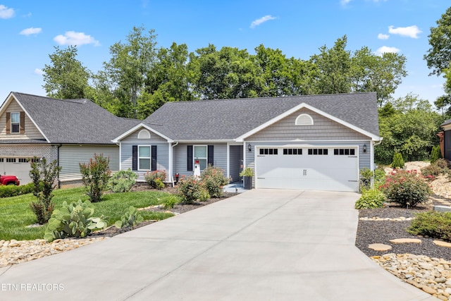 151 Utsesti Way, Loudon, TN 37774 - ranch-style house with an attached garage, concrete driveway, and roof with shingles