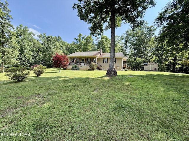 406 Asheville Hwy, Strawberry Plains, TN 37871 - view of grassy yard featuring covered porch
