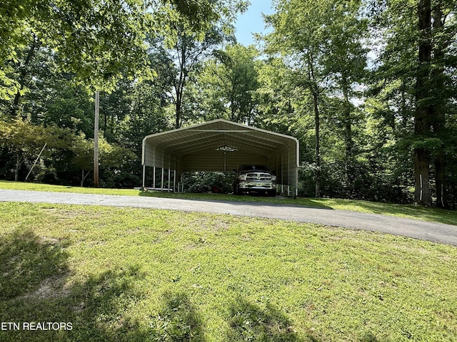 406 Asheville Hwy, Strawberry Plains, TN 37871 - view of parking / parking lot featuring driveway and a carport
