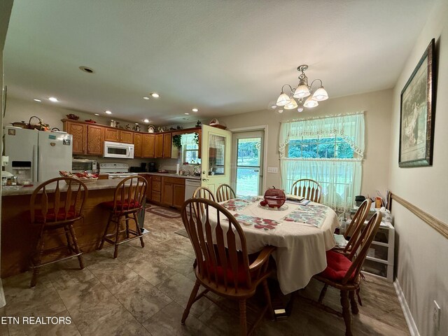 406 Asheville Hwy, Strawberry Plains, TN 37871 - dining space with a chandelier and recessed lighting