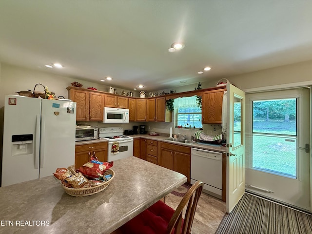 406 Asheville Hwy, Strawberry Plains, TN 37871 - kitchen featuring white appliances, recessed lighting, a sink, and brown cabinets