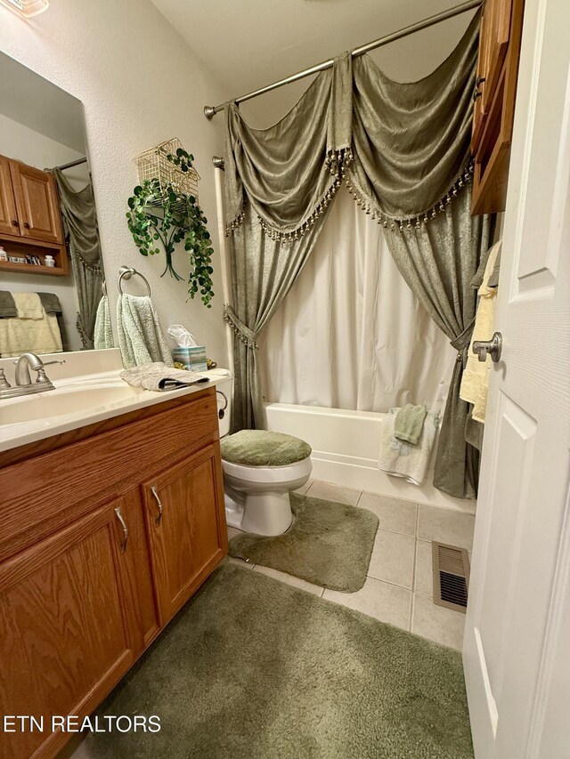 406 Asheville Hwy, Strawberry Plains, TN 37871 - full bath featuring shower / bath combination with curtain, vanity, toilet, and tile patterned flooring