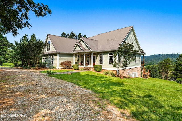 300 County Road 876, Englewood, TN 37329 - view of front of home with a front yard, a porch, and metal roof