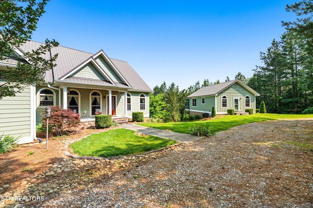 300 County Road 876, Englewood, TN 37329 - view of front of house with covered porch, a standing seam roof, a front lawn, and metal roof