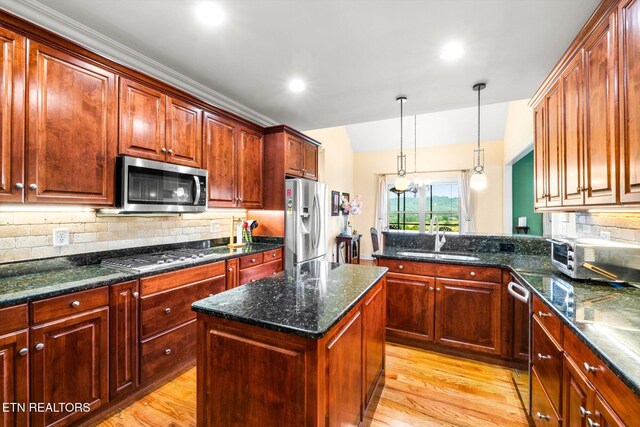 300 County Road 876, Englewood, TN 37329 - kitchen with appliances with stainless steel finishes, a sink, light wood-type flooring, tasteful backsplash, and recessed lighting