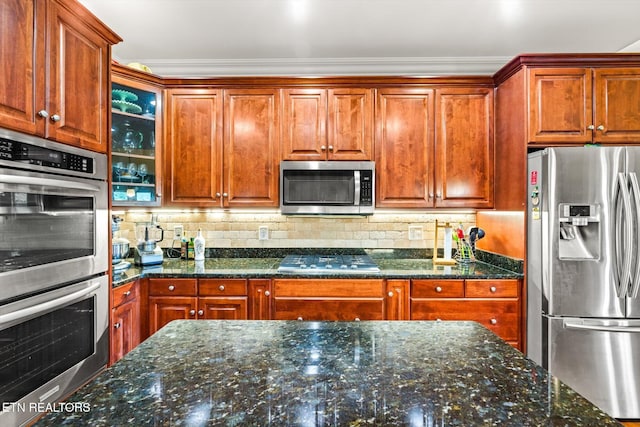 300 County Road 876, Englewood, TN 37329 - kitchen featuring stainless steel appliances, glass insert cabinets, backsplash, crown molding, and dark stone countertops