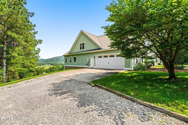 300 County Road 876, Englewood, TN 37329 - traditional-style home with concrete driveway, a garage, and a front yard