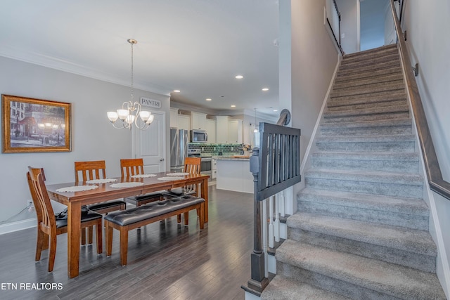 102 Deerberry Ln, Oak Ridge, TN 37830 - dining room featuring stairs, a chandelier, dark wood-style floors, baseboards, and ornamental molding