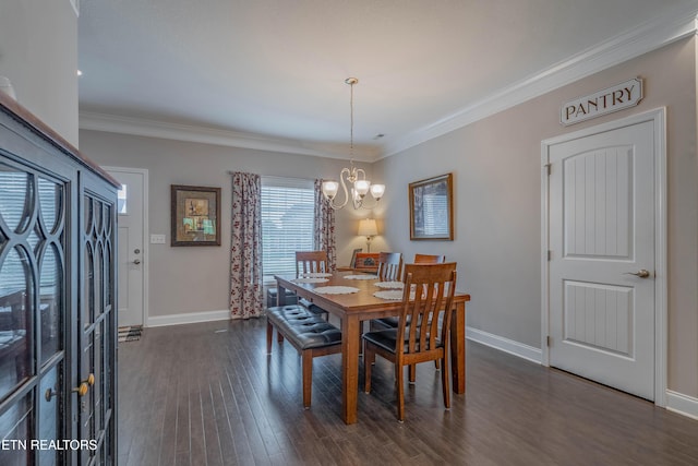 102 Deerberry Ln, Oak Ridge, TN 37830 - dining space featuring a chandelier, dark wood-style flooring, baseboards, and crown molding