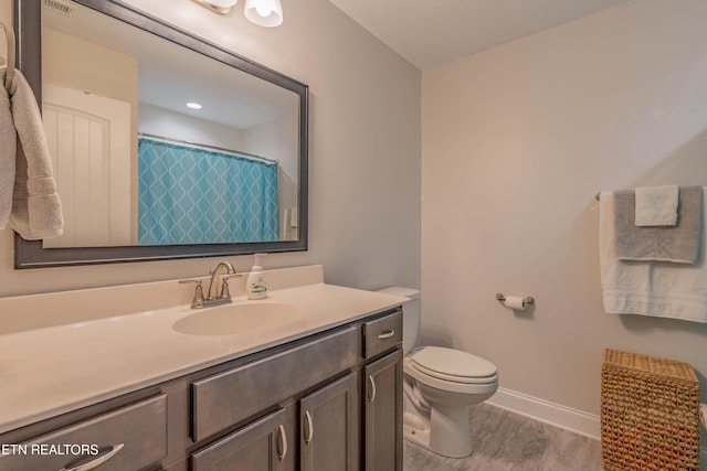 102 Deerberry Ln, Oak Ridge, TN 37830 - bathroom featuring vanity, toilet, baseboards, and wood finished floors
