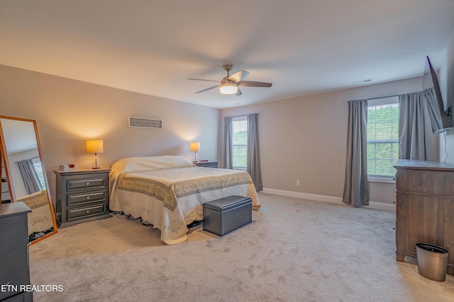 102 Deerberry Ln, Oak Ridge, TN 37830 - bedroom featuring multiple windows, light colored carpet, baseboards, and ceiling fan
