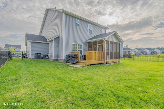 102 Deerberry Ln, Oak Ridge, TN 37830 - rear view of property featuring a sunroom, central air condition unit, and a wooden deck