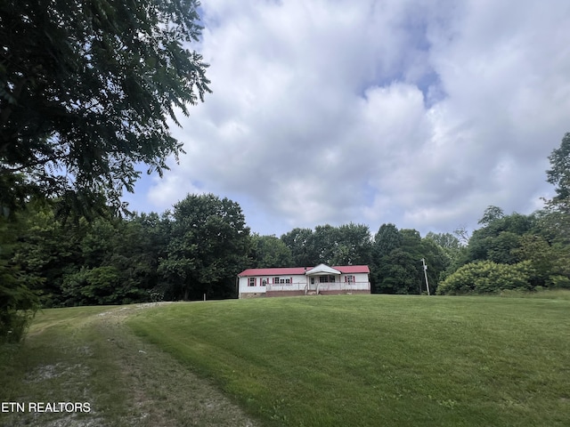 1311 Old Union Rd, Hilham, TN 38568 - view of front facade with a front lawn and a wooded view