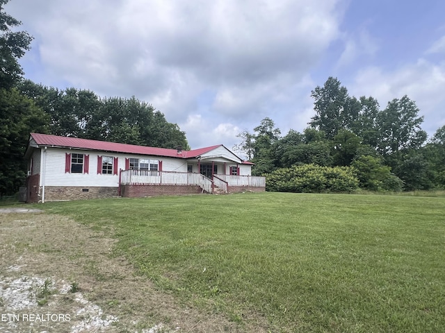 1311 Old Union Rd, Hilham, TN 38568 - view of front of home featuring a front lawn, a deck, metal roof, and crawl space