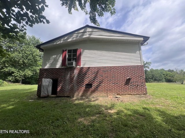 1311 Old Union Rd, Hilham, TN 38568 - view of home's exterior featuring a lawn, cooling unit, and brick siding