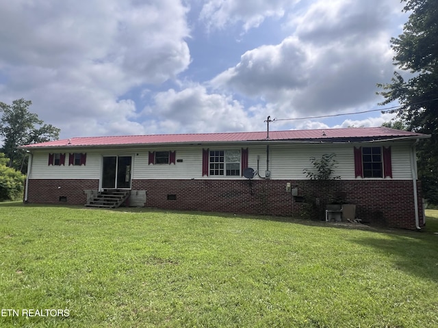 1311 Old Union Rd, Hilham, TN 38568 - rear view of house with entry steps, crawl space, a lawn, and metal roof