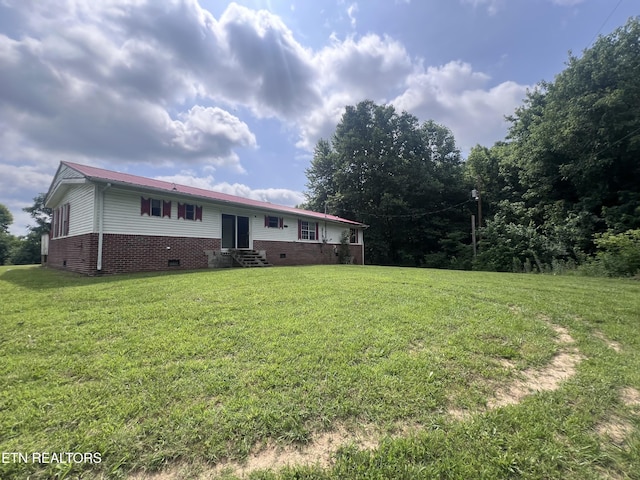 1311 Old Union Rd, Hilham, TN 38568 - rear view of house with entry steps, crawl space, and a yard