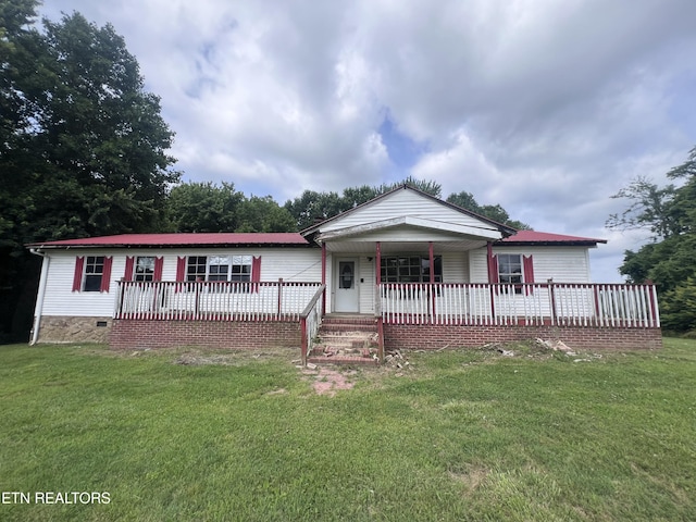 1311 Old Union Rd, Hilham, TN 38568 - view of front of house featuring a front yard, covered porch, crawl space, and metal roof