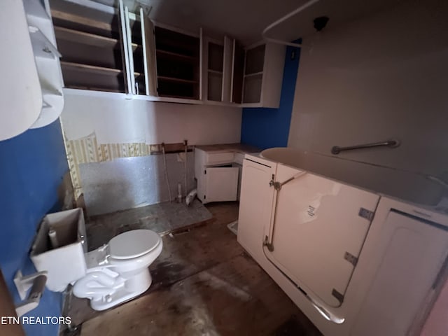 1311 Old Union Rd, Hilham, TN 38568 - bathroom with toilet and unfinished concrete floors