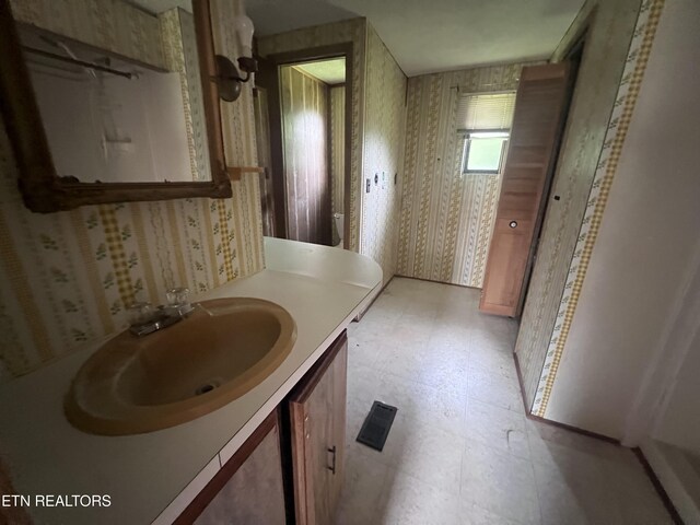 1311 Old Union Rd, Hilham, TN 38568 - bathroom featuring wallpapered walls, vanity, tile patterned floors, and toilet