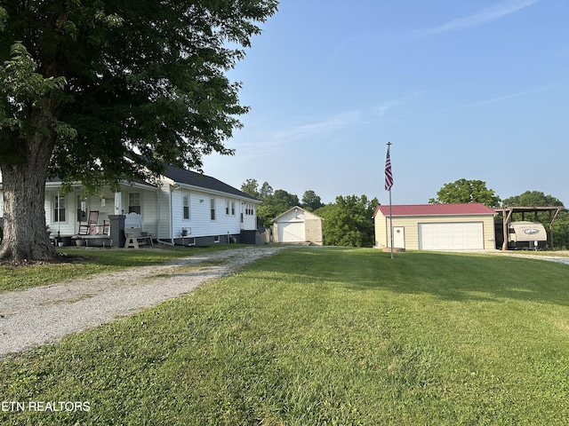245 Lake Shore Ln, Lafollette, TN 37766 - view of front of property with an outbuilding, a front yard, and driveway