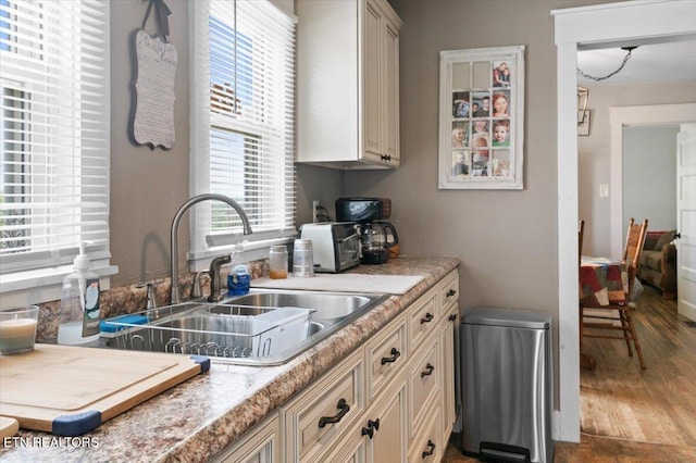 245 Lake Shore Ln, Lafollette, TN 37766 - kitchen with wood finished floors, cream cabinetry, and light stone counters