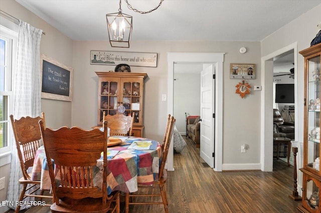 245 Lake Shore Ln, Lafollette, TN 37766 - dining room with dark wood-type flooring and baseboards